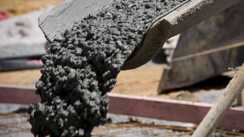 Autonomous Cruise taxi drives through road construction site into freshly poured concrete