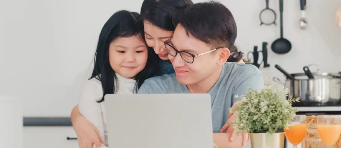 young Asian family having happy moment at home together