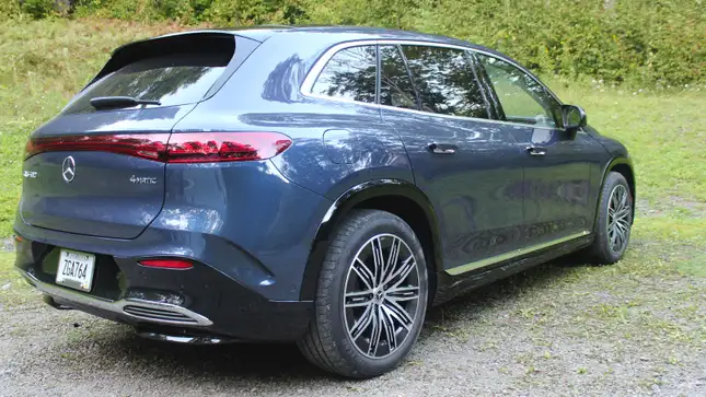 A photo of the rear quarter of a Mercedes EQS SUV. 