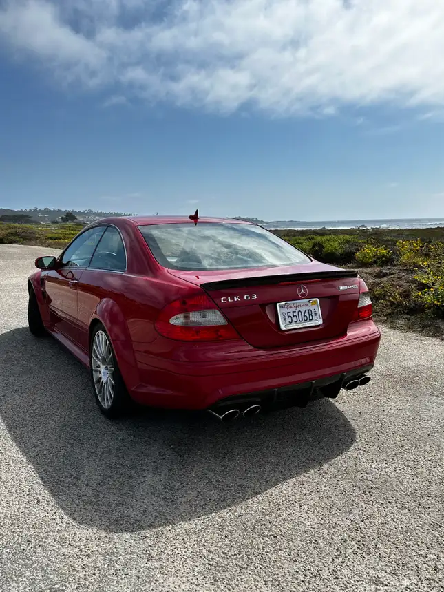 The rear of a 2008 Mercedes Benz CLK63 Black Series in red