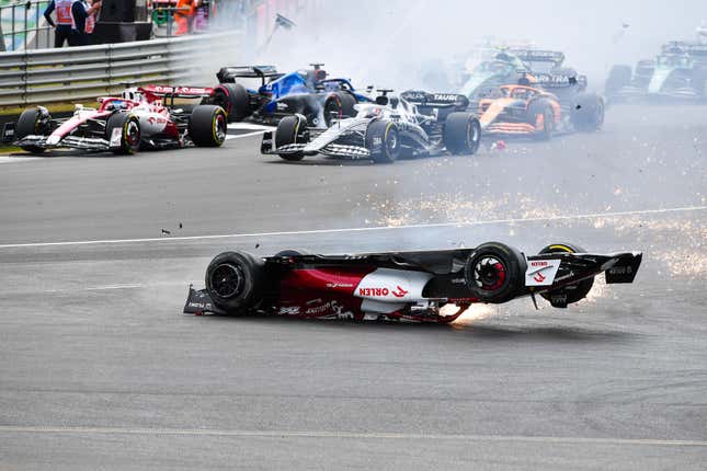 Alfa Romeo's Chinese driver Zhou Guanyu crashes out at the start of the Formula One British Grand Prix at the Silverstone motor racing circuit in Silverstone, Britain, on July 3, 2022.