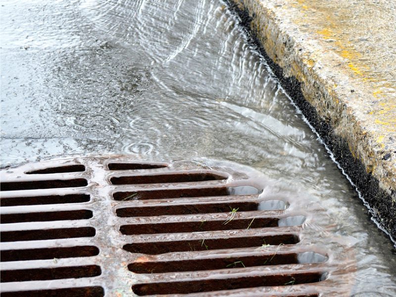 Rain flowing into a sewer