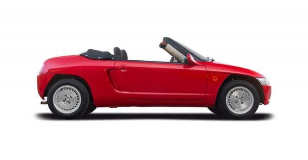 Red Honda Beat kei car on white background