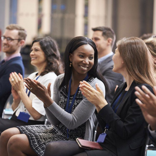 Audience Applauding At Business Conference