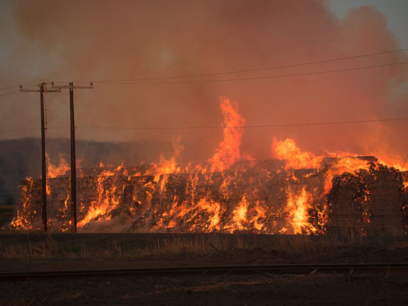 Burning hay stacks