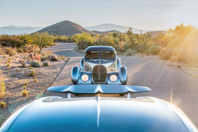 Front view of a Bugatti Type 57 SC Atlantic with a Chiron Super Sport in the foreground