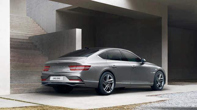 Rear 3/4 view of a grey Genesis G80 sedan