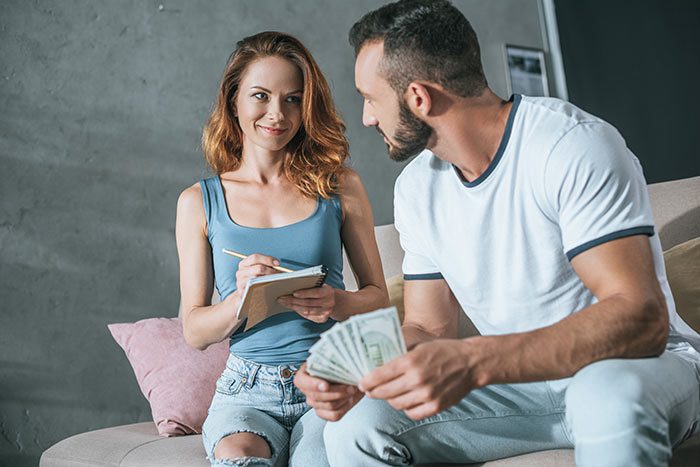 Couple making a plan for using life insurance to pay off debt