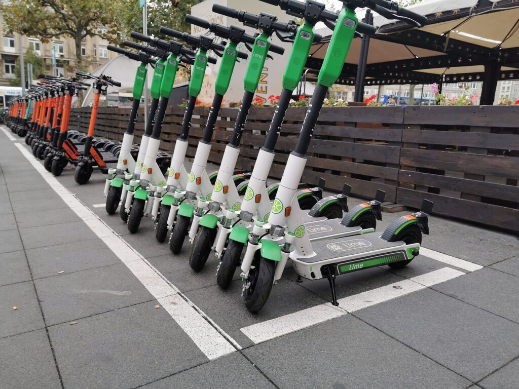 escooters lined up in parking bay