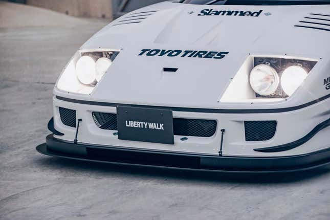 Front bumper of a white Autozam AZ-1 with a Ferrari F40 bodykit