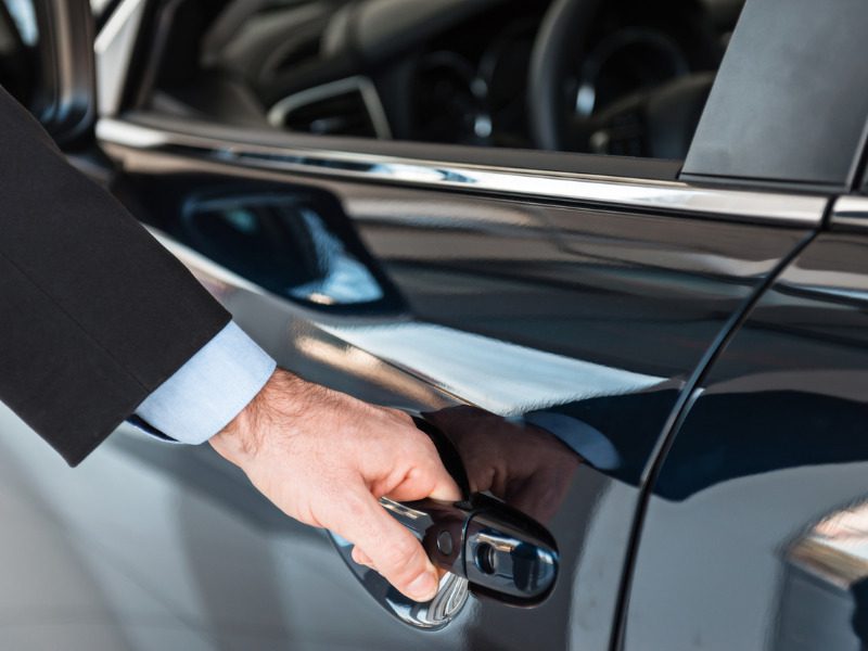 Man getting into a rental car after a collision claim