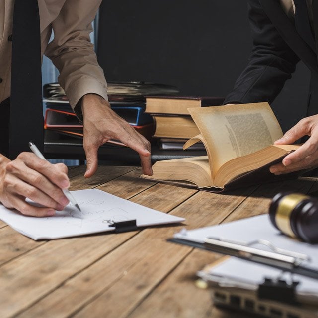 Legal personnel working on legal documents