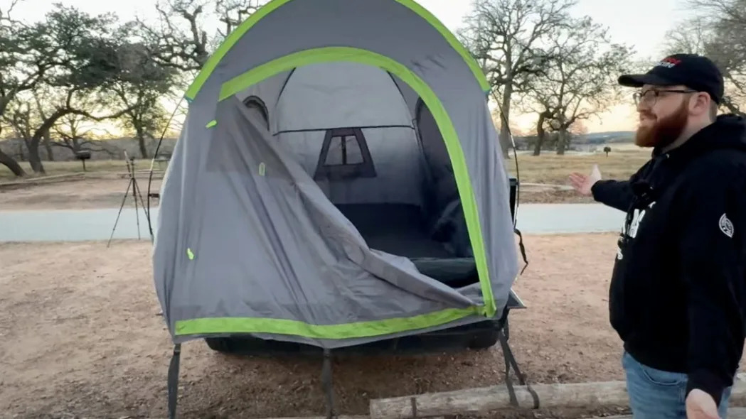 Cybertruck owner bought a truck tent to go camping.