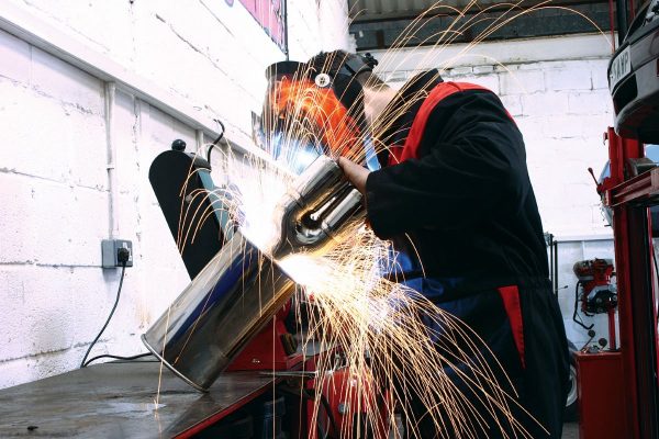 Engineer working on car parts