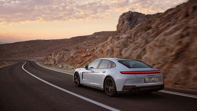 The rear of a white Panamera 4S E-Hybrid driving through the desert