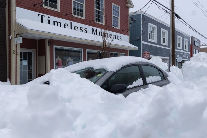 Snow fall covering a car in Nova Scotia