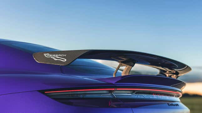 Rear wing of a purple Porsche Taycan Turbo GT