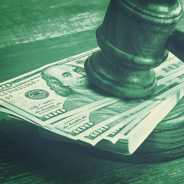 Judges Gavel on a bundle of money