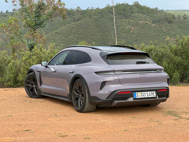 Rear 3/4 view of a lavender 2025 Porsche Taycan Turbo S Cross Turismo