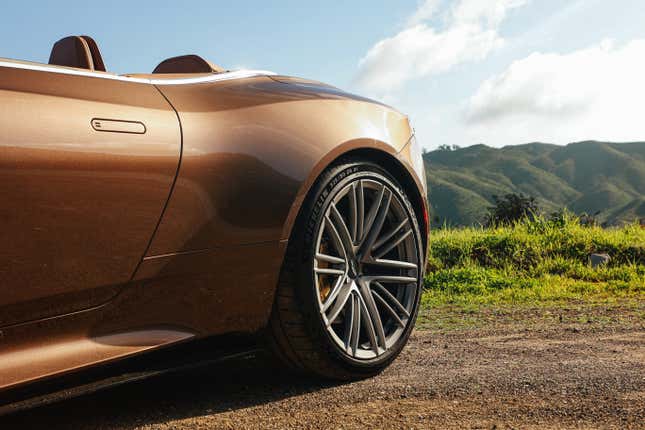 Rear fender of a brown Aston Martin DB12 Volante