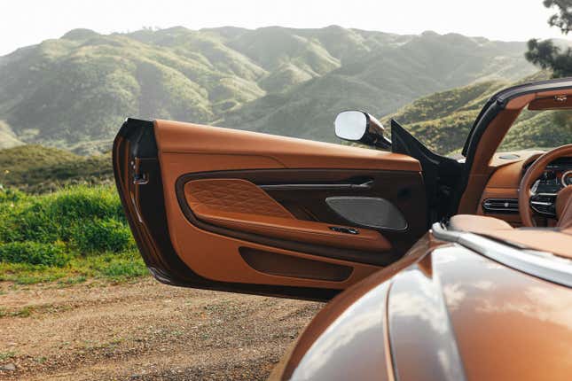 Door panel of a brown Aston Martin DB12 Volante