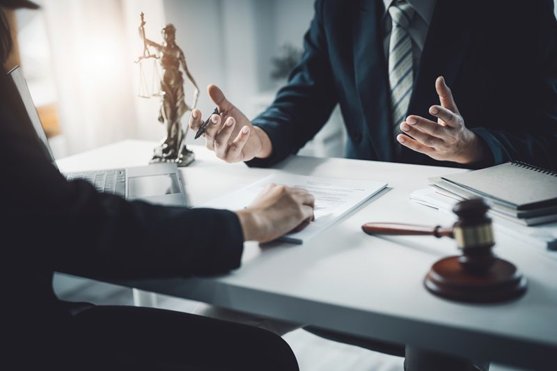 Law, Consultation, Agreement, Contract, Attorney or Lawyer holding a pen is consulting with a client to explain the pattern of answering questions before going to court to decide a lawsuit.