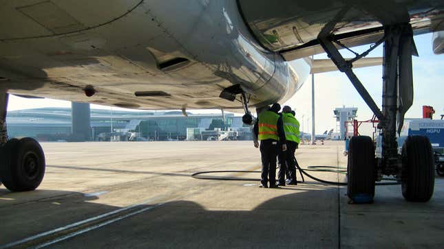 A photo of a ram air turbine underneath a plane. 