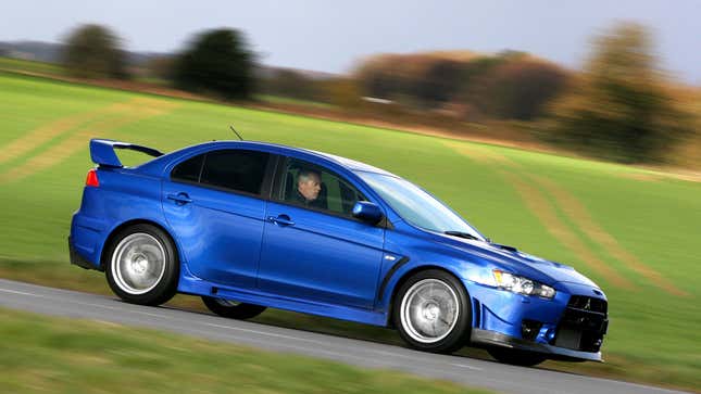 A photo of a blue Mitsubishi Lancer Evolution. 