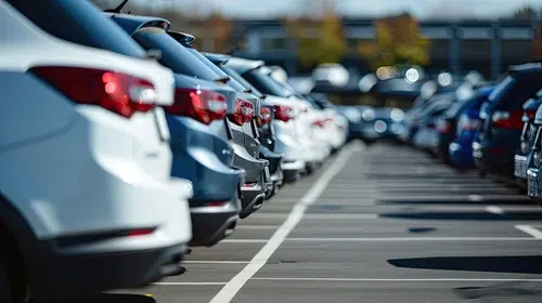 Lined of parked cars from different car insurance groups.