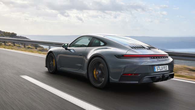 Rear 3/4 view of a grey 2025 Porsche 911 Carrera GTS