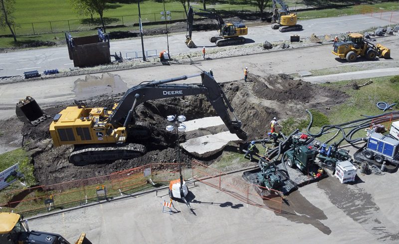 Workers repair a major water main in Calgary