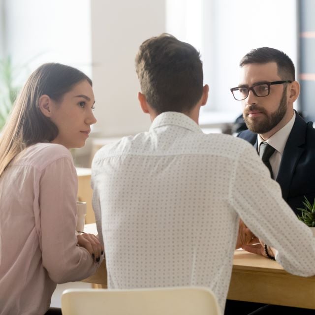 An advisor with a young couple