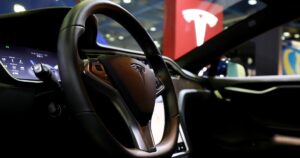 Tesla hires former GEICO exec