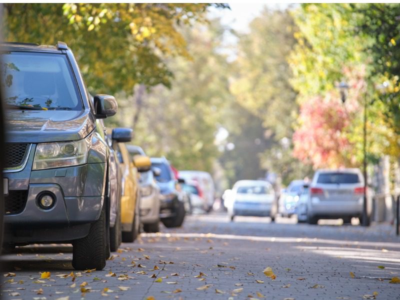 Close up of an auto mobile parked on a cities suburban street