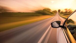 high risk car insurance- car speeding down highway
