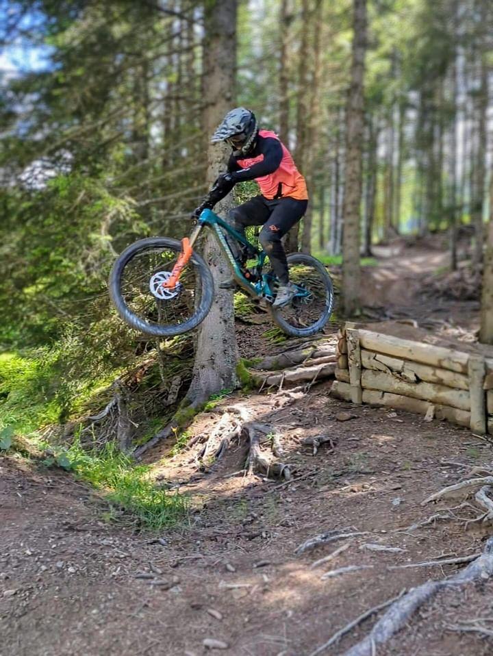 Mountain biker riding off a jump