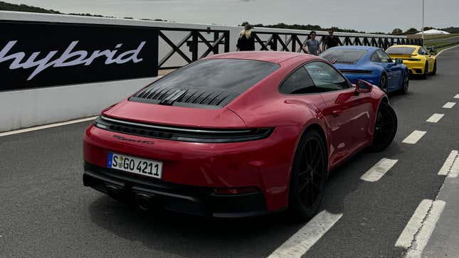 Rear 3/4 view of a red 2025 Porsche 911 Carrera GTS