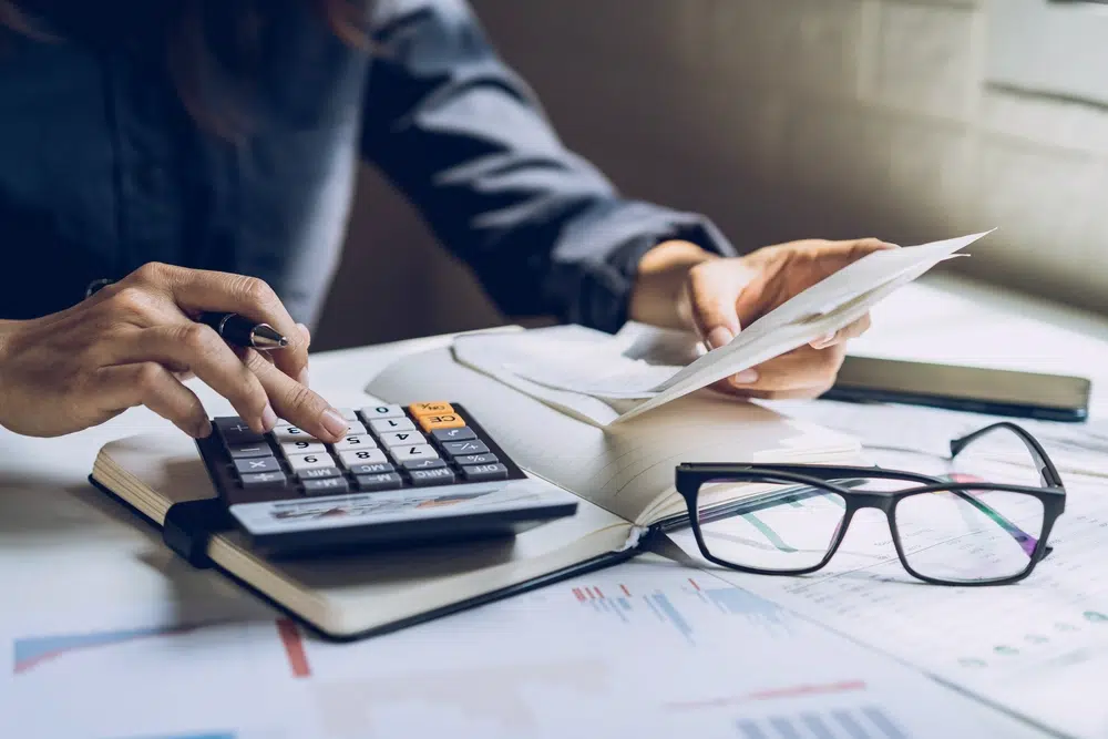 A man calculating his tax.