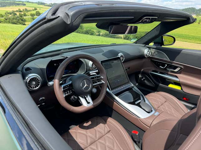 Interior and dashboard of a matte green Mercedes-AMG SL63 S E Performance