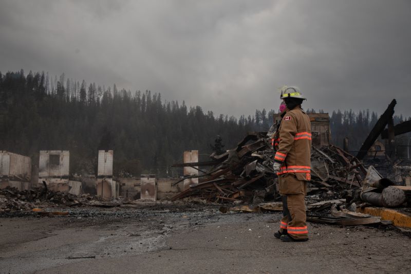 Fire crews work to put out hotspots in the Maligne Lodge in Jasper, Alta., on Friday July 26, 2024. Wildfires encroaching into the townsite of Jasper forced an evacuation of the national park and have destroyed over 300 of the town's approximately 1100 structures, mainly impacting residential areas. THE CANADIAN PRESS/Amber Bracken