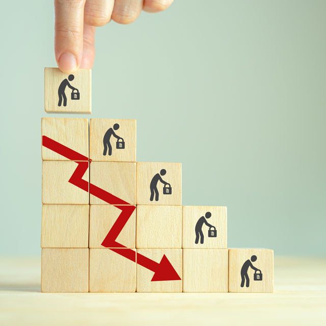 Stacked wooden blocks with red down arrow