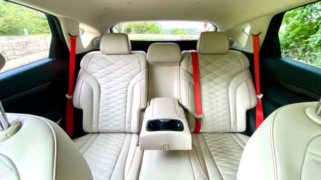 A photo of the rear seats of the GV80 Coupe showing orange belts