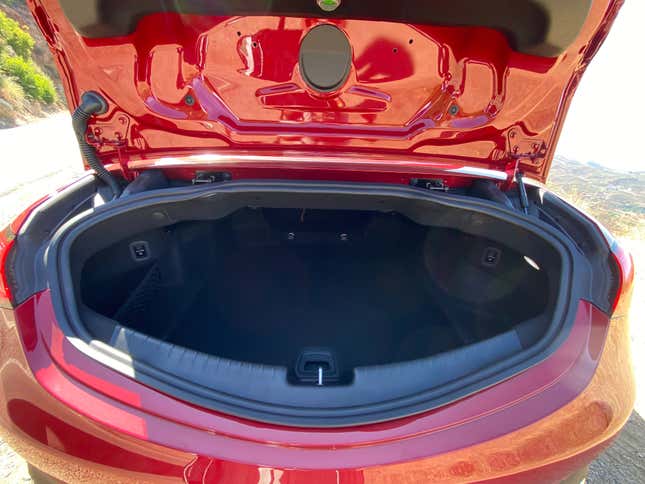 A side-by-side of the CLE Cabriolet's trunk with and without the divider deployed