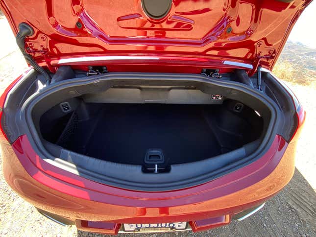 A side-by-side of the CLE Cabriolet's trunk with and without the divider deployed