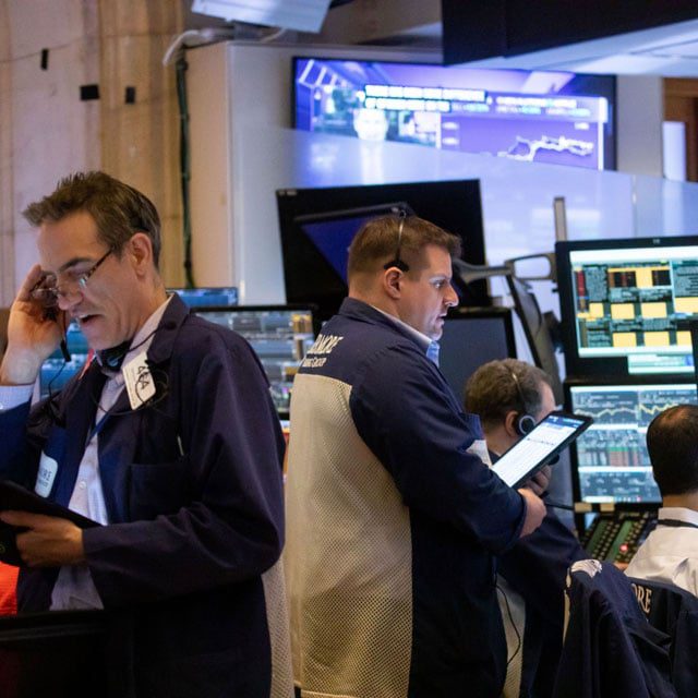 Traders on the floor of the NYSE