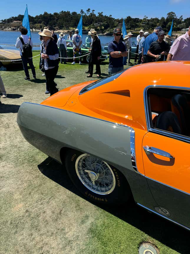 Rear fender of an orange and grey 1954 Ferrari 375 MM Ghia Coupe