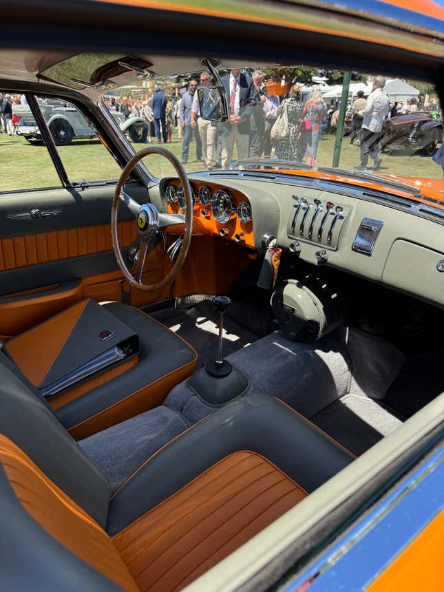 Interior of an orange and grey 1954 Ferrari 375 MM Ghia Coupe