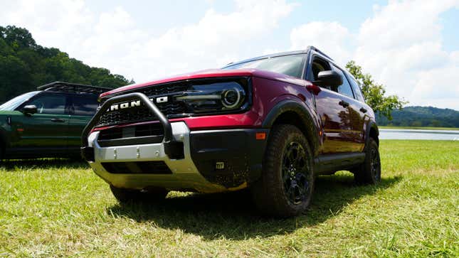 A red 2025 Ford Bronco Sport Sasquatch parked by a lake