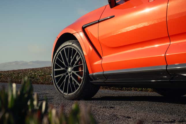 Front wheel of an orange 2025 Aston Martin DBX707