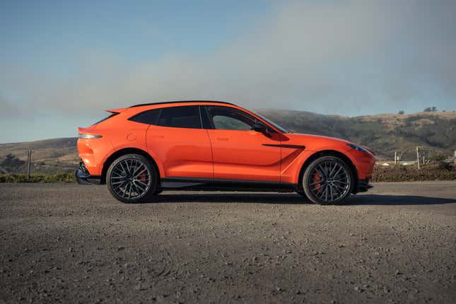 Side view of an orange 2025 Aston Martin DBX707